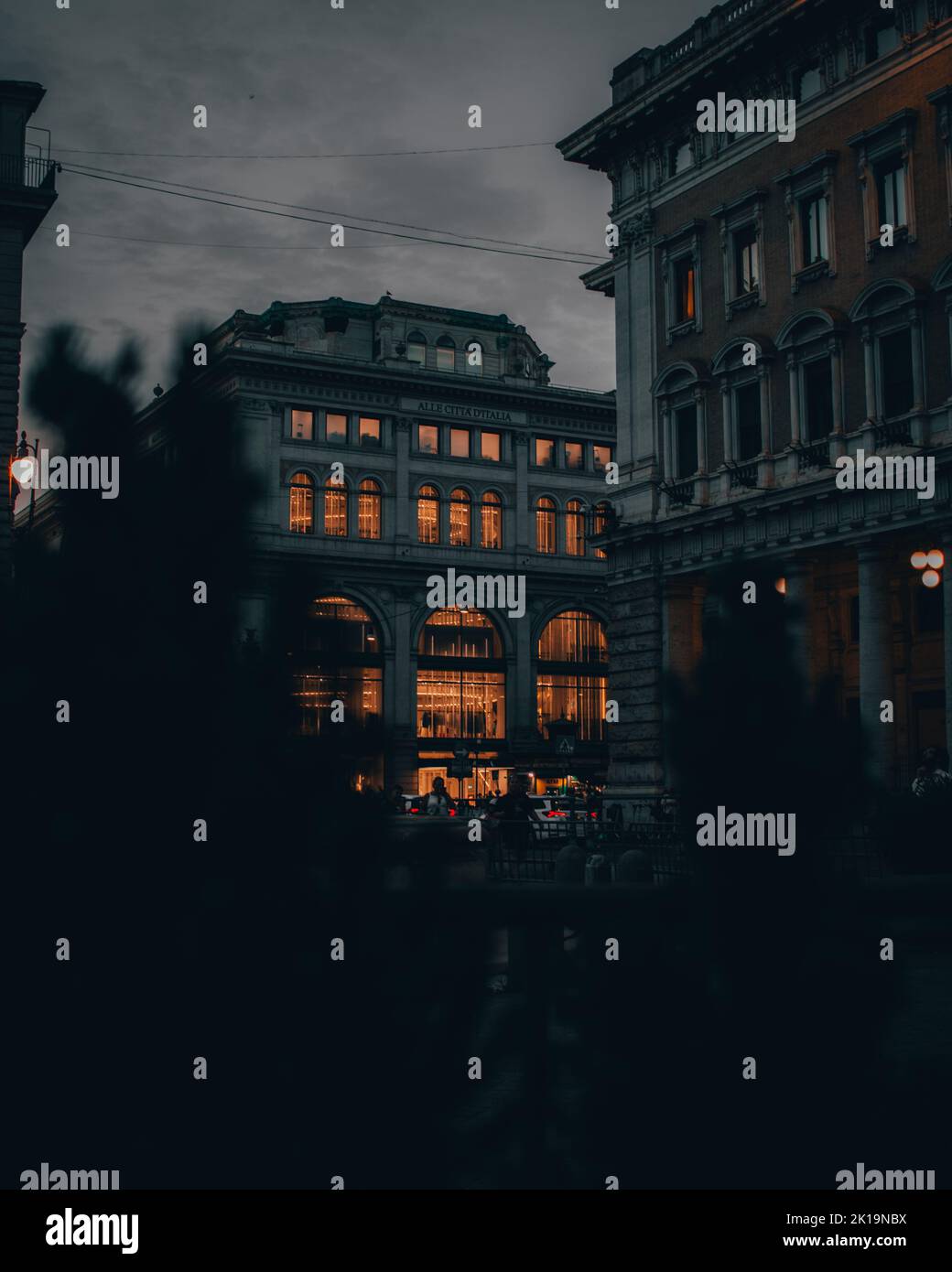 A beautiful view of ZARA shopping center in a distance in Rome at night