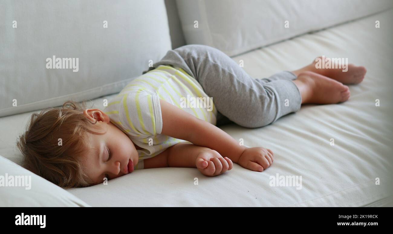 Candid baby sleeping. One year old infant asleep napping Stock Photo