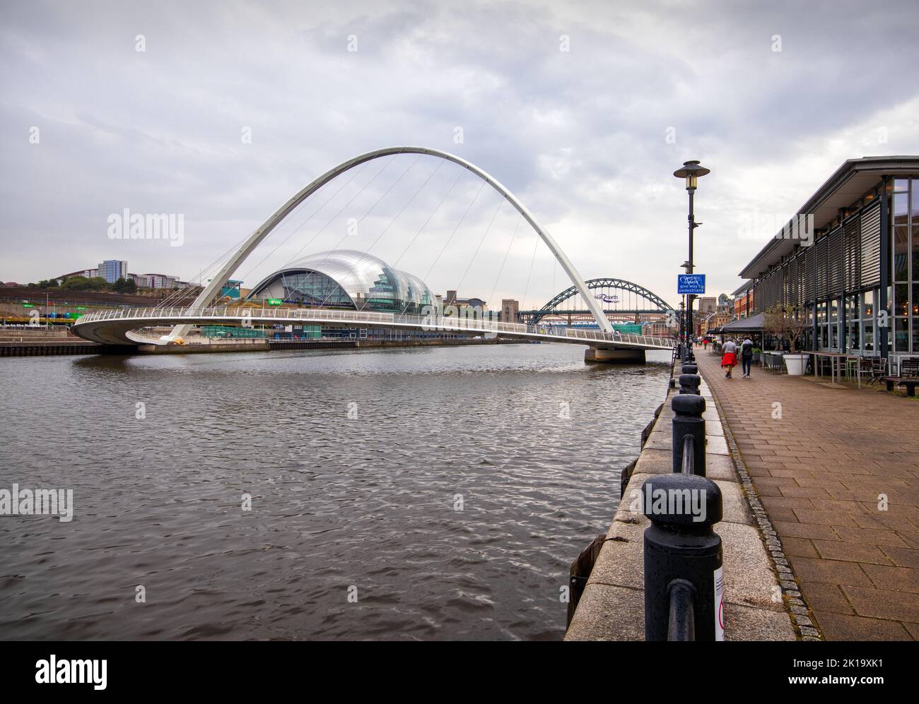 Looking along the quayside towards the iconic bridges spanning the River Tyne, at Newcastle upon Tyne Stock Photo