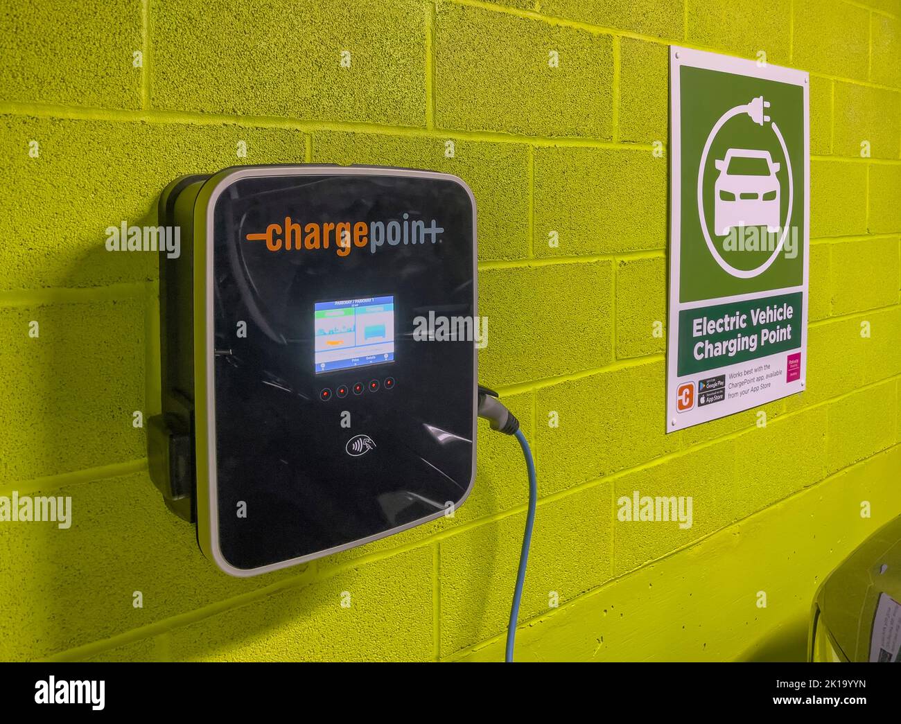 Newbury, Berkshire, England, UK. 2022. Electric car battery charging unit in an underground car park. Stock Photo