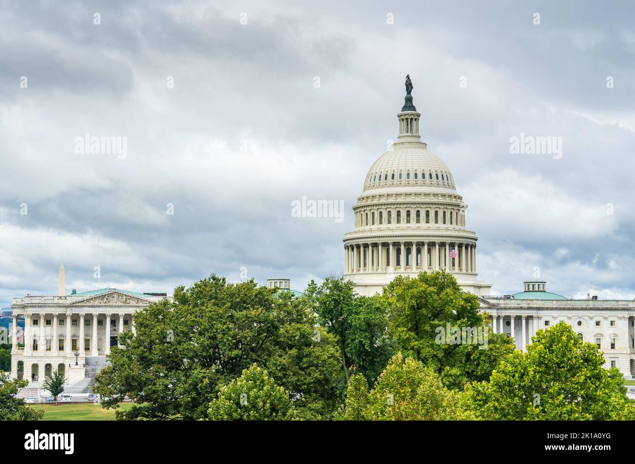 United States Capitol building in Washington, DC with storm clouds above Stock Photo