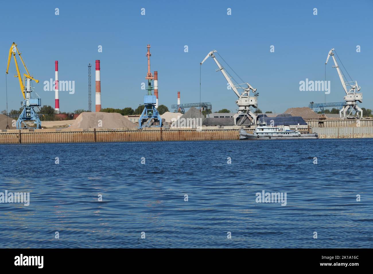 River port. Port cranes on the river bank. Nizhny Novgorod, Oka River. High quality photo Stock Photo