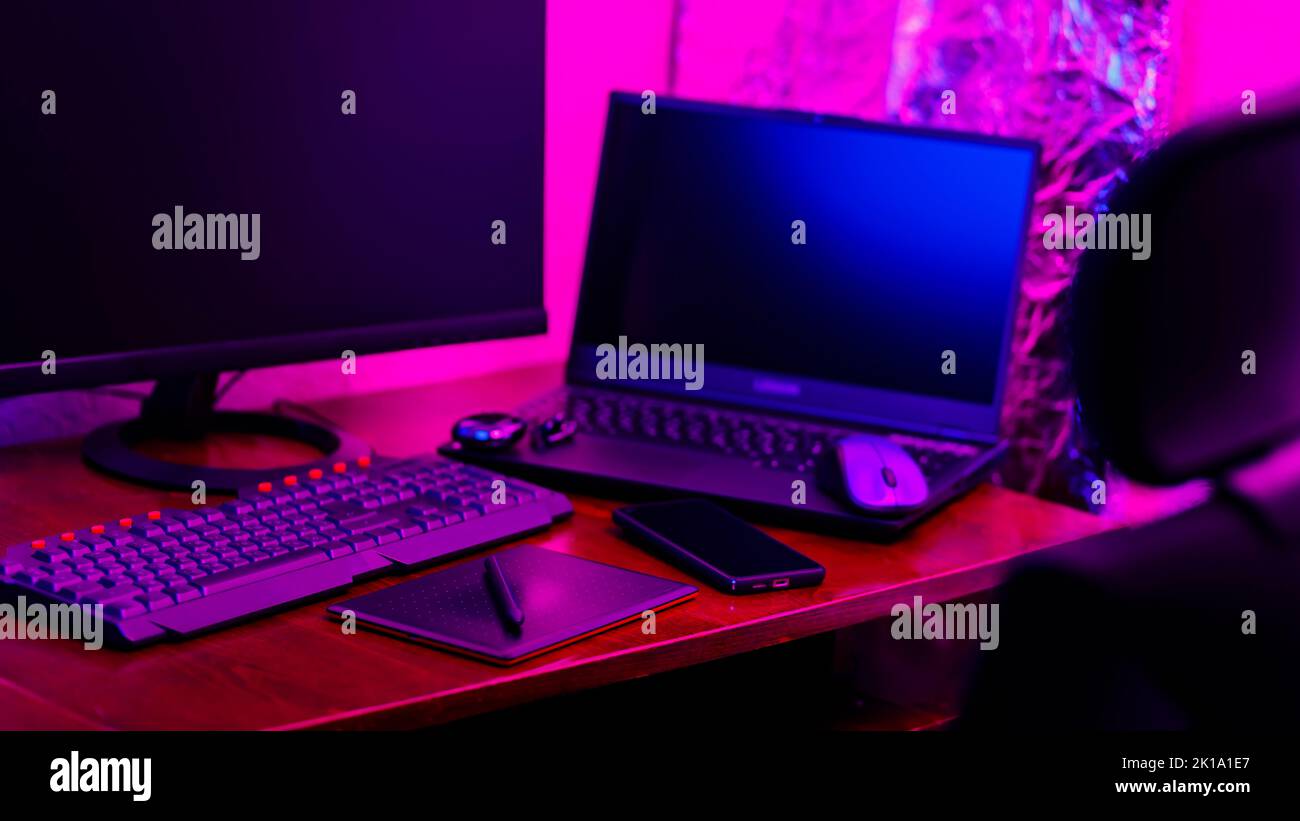 Creative designer's workplace, back view. Office chair and work desk