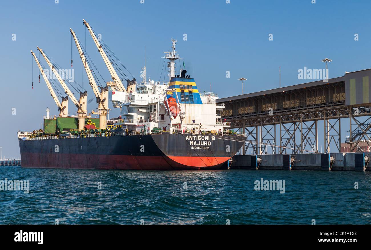 Ras Al Khair, Saudi Arabia - December 25, 2019: Bulk carrier loading in port Stock Photo