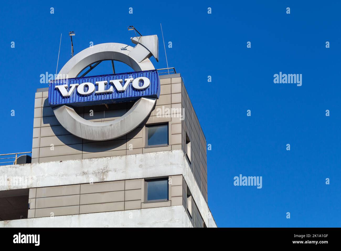 St. Petersburg, Russia - August 09, 2022: Volvo cars logotype mounted on a car retail center facade Stock Photo