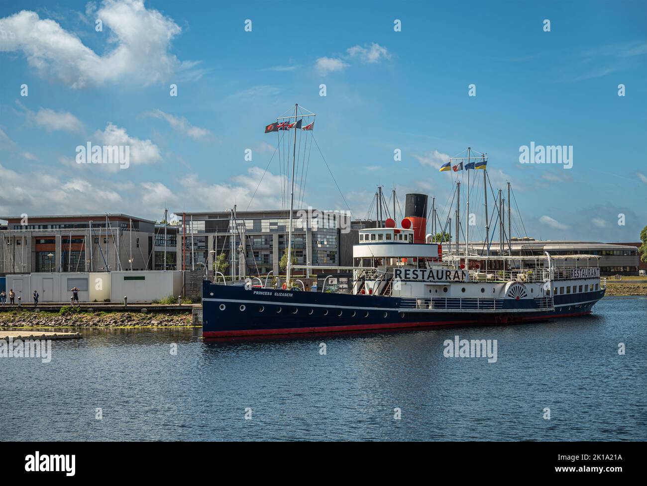 Europe, France, Dunkerque - July 9, 2022: Princess Elizabeth restaurant boat in Port du Bassin de la Marine under blue cloudscape. Stock Photo