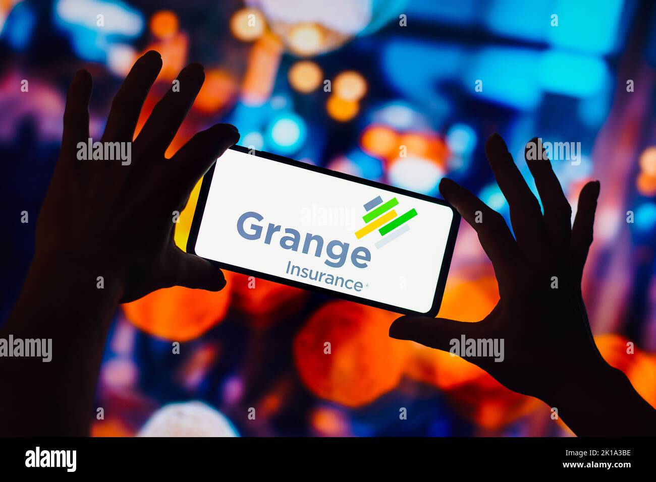 In this photo illustration, the Grange insurance logo is seen displayed