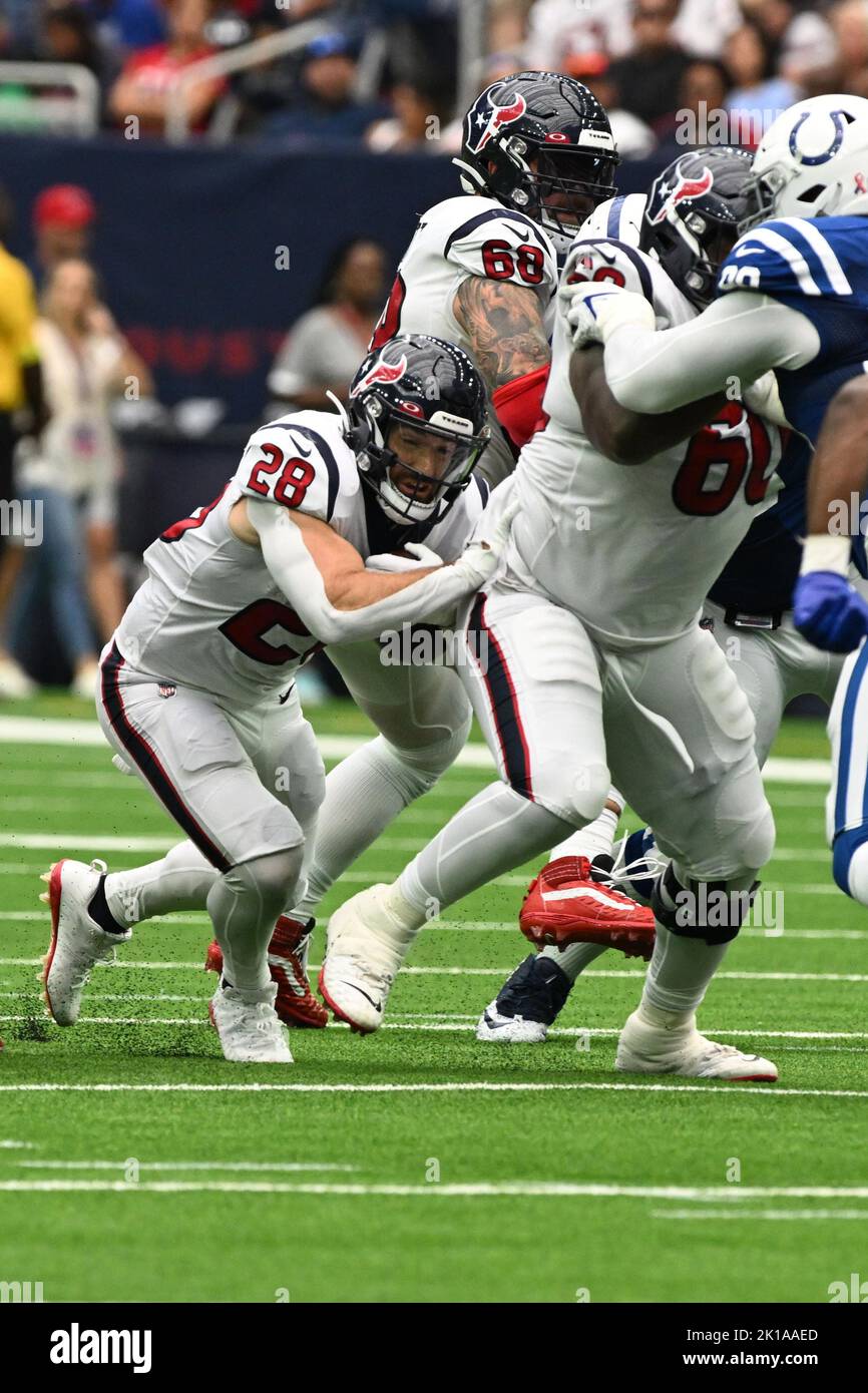 Houston Texans running back Rex Burkhead (28) follows the blocking by Houston Texans guard A.J. Cann (60) during the NFL football game between the Ind Stock Photo