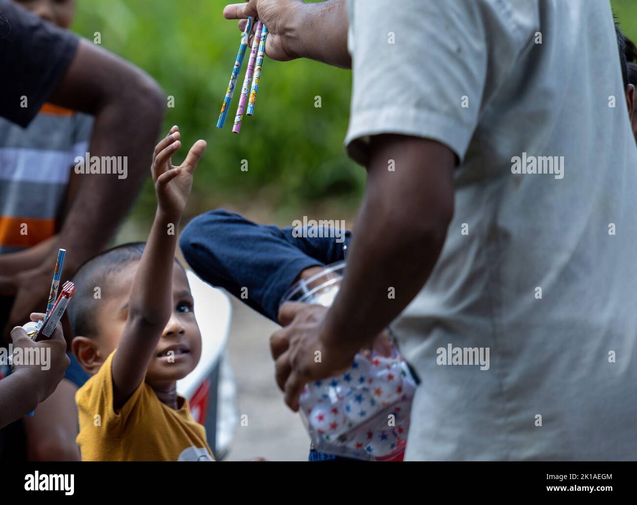 Donating pens and pencils to poor children in Sri Lanka 30th July 2022