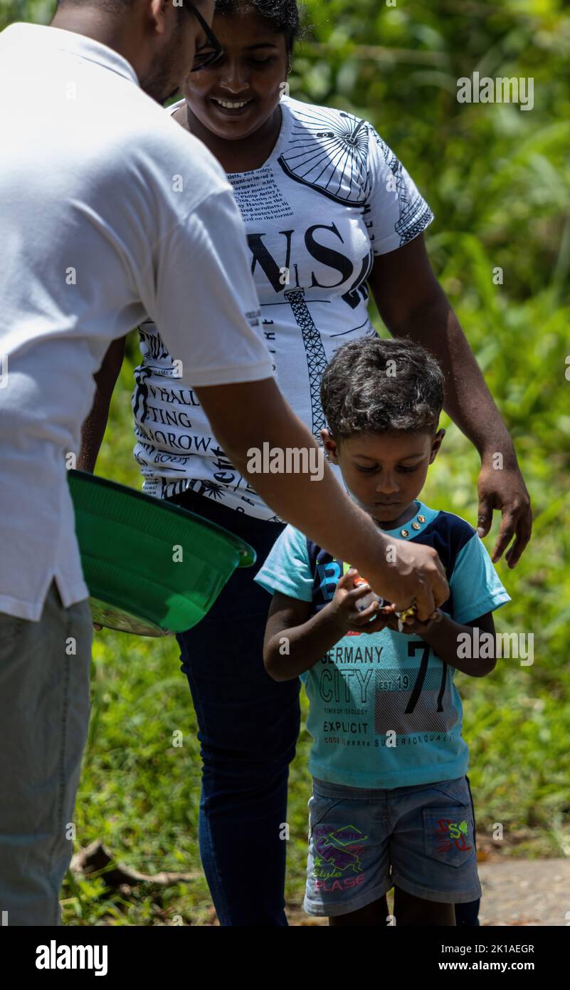 Donating sweets to poor children in Sri Lanka 30th July 2022 Stock Photo