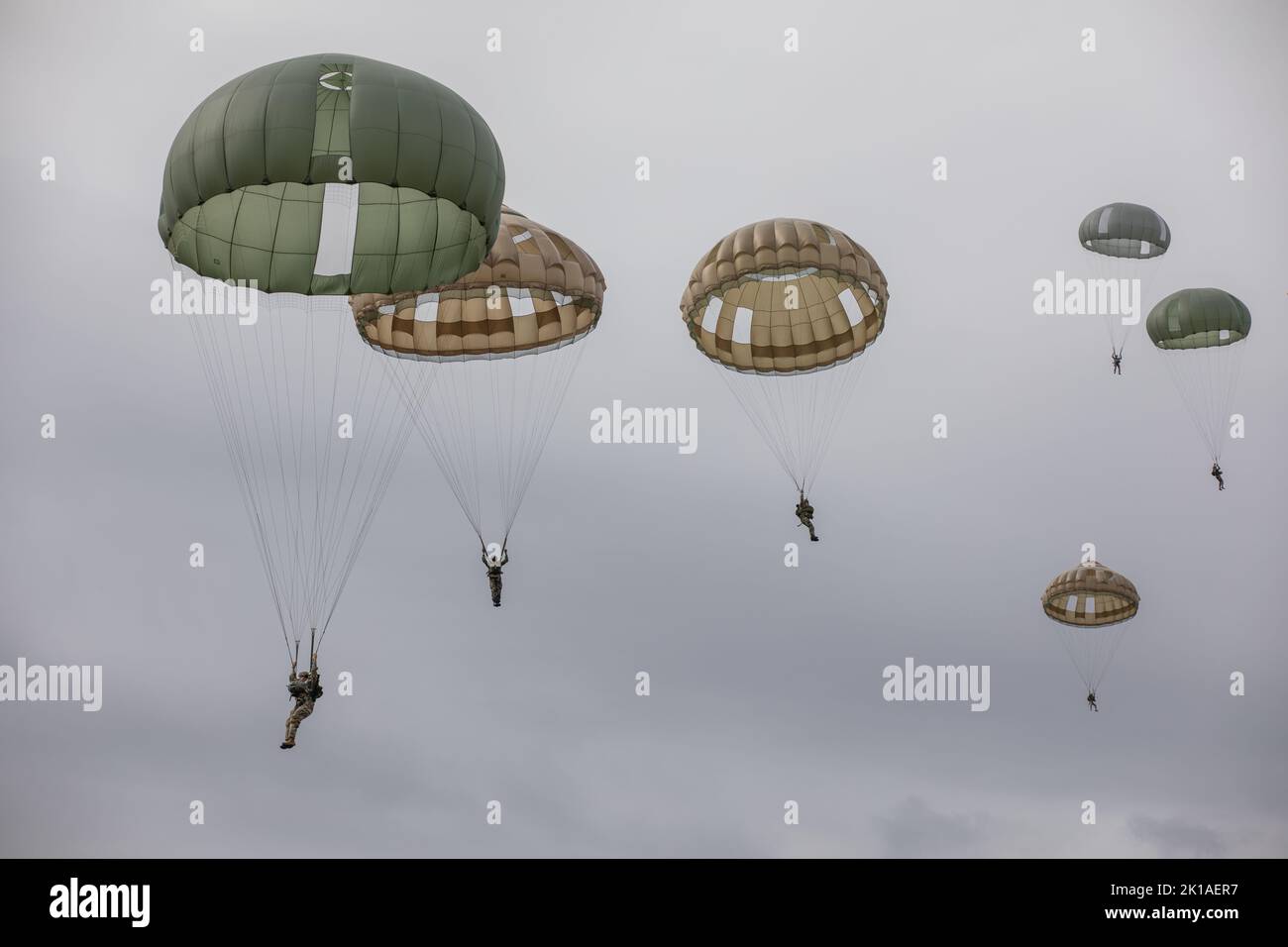 A group of U.S. Army and European Paratroopers conduct an Airborne jump