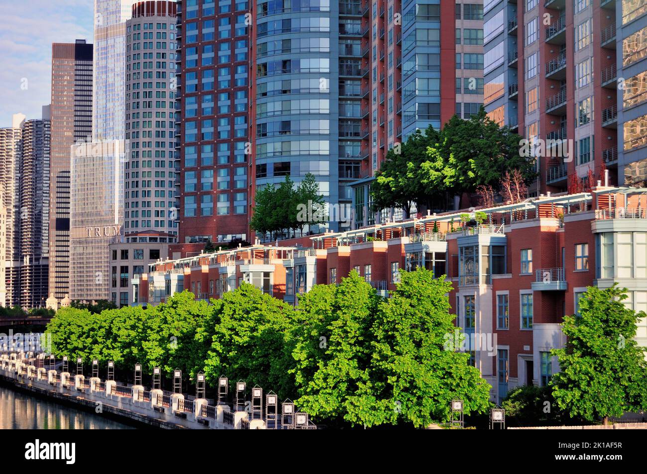 HIgh-rise condominiums and townhouse line the north shore of the Chicago River in Chicago's  River East neighborhood. The area is a haven for high cos Stock Photo