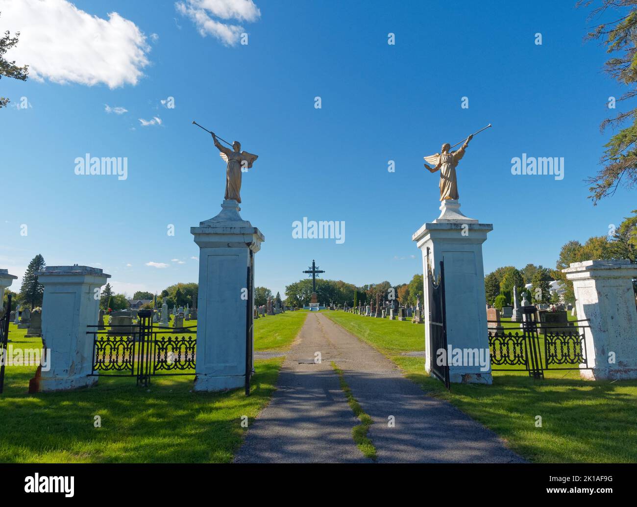 Gated entrance to Catholic cemetery in Berthierville. Quebec,Canada Stock Photo