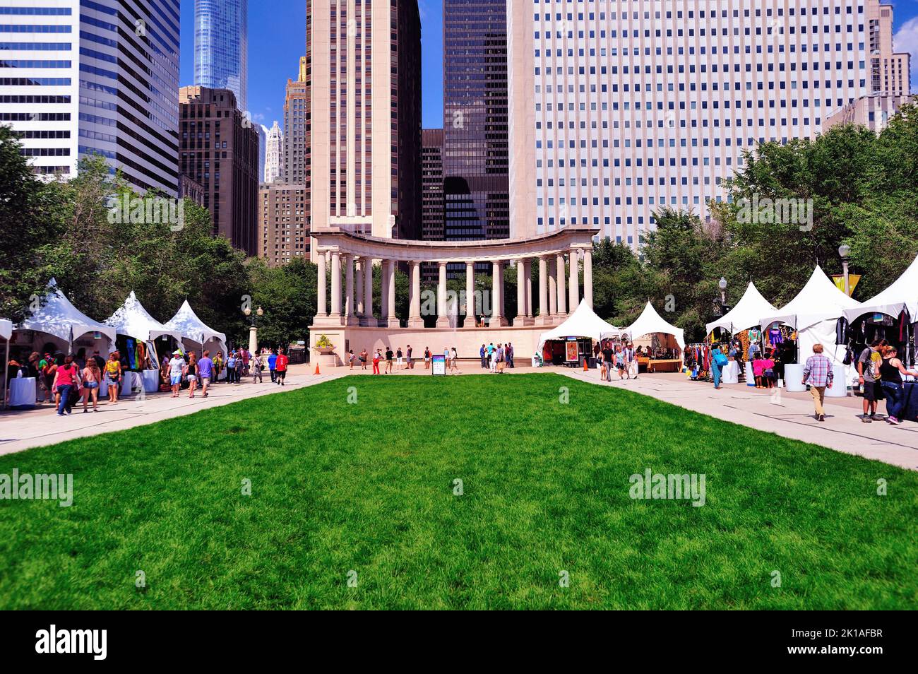 Chicago, Illinois, USA. Tents erected for the Chicago Jazz Festival dot the lawn area at Wrigley Square in Millennium Park. Stock Photo