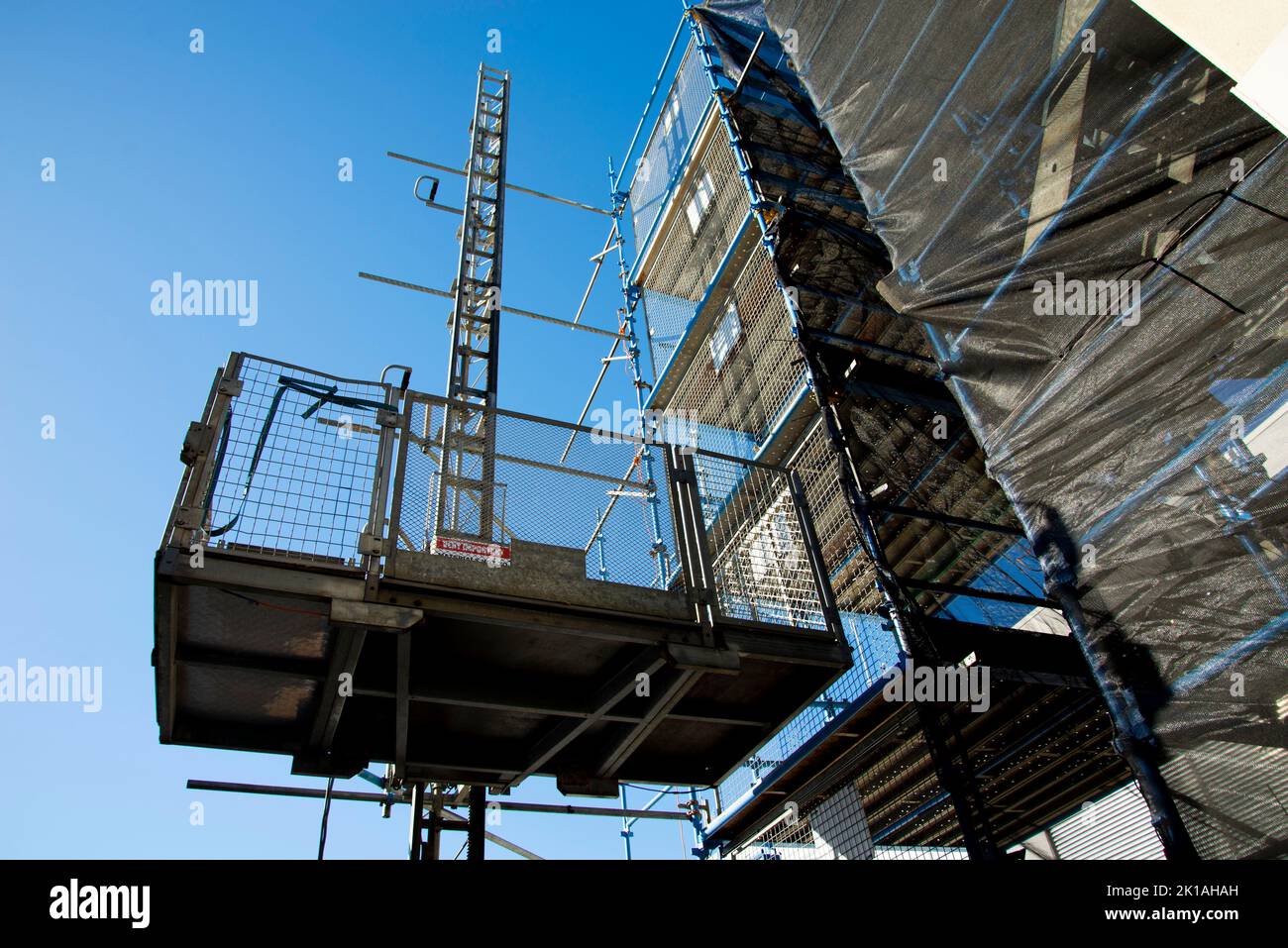 Construction Hoist in a Scaffold Stock Photo