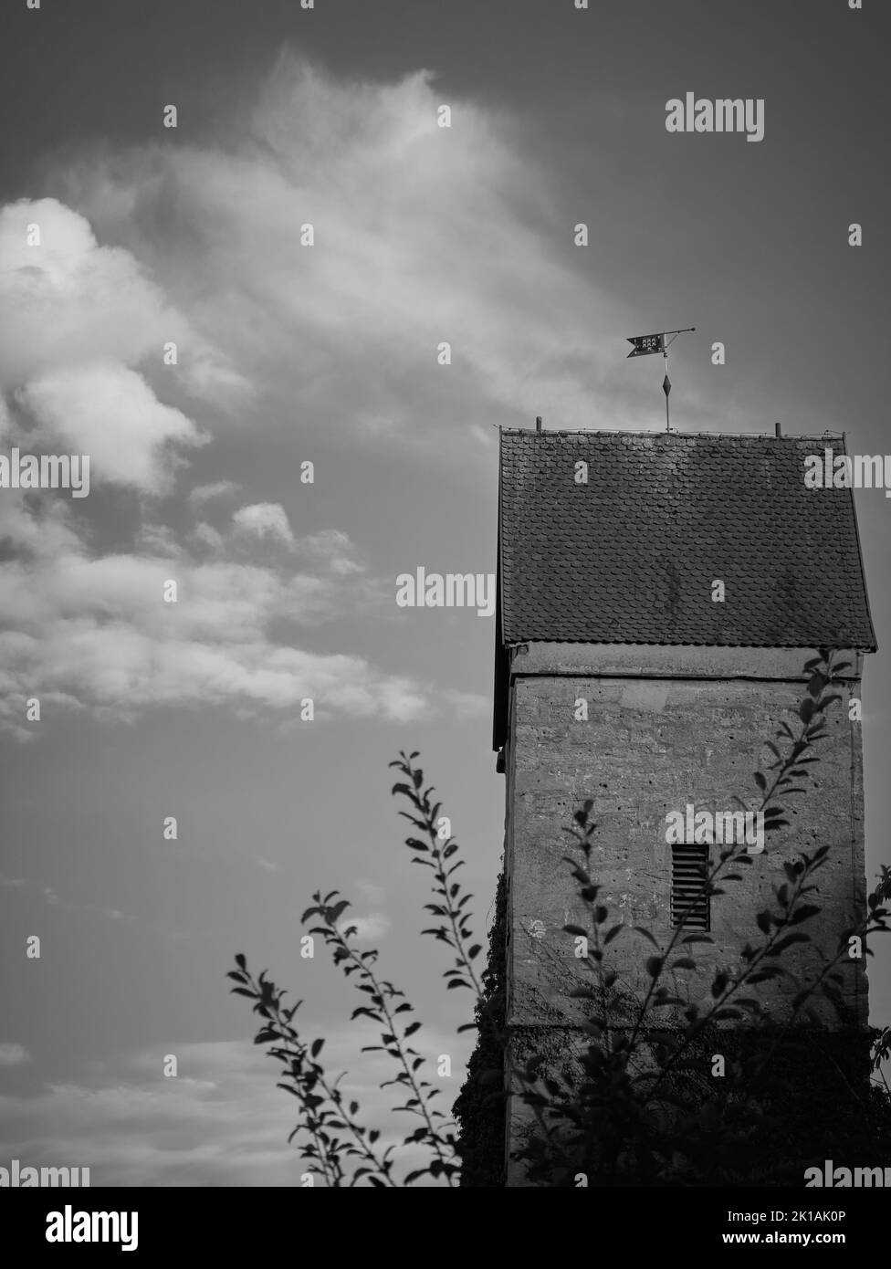 A black and white of the building and a cloudy sky Stock Photo - Alamy