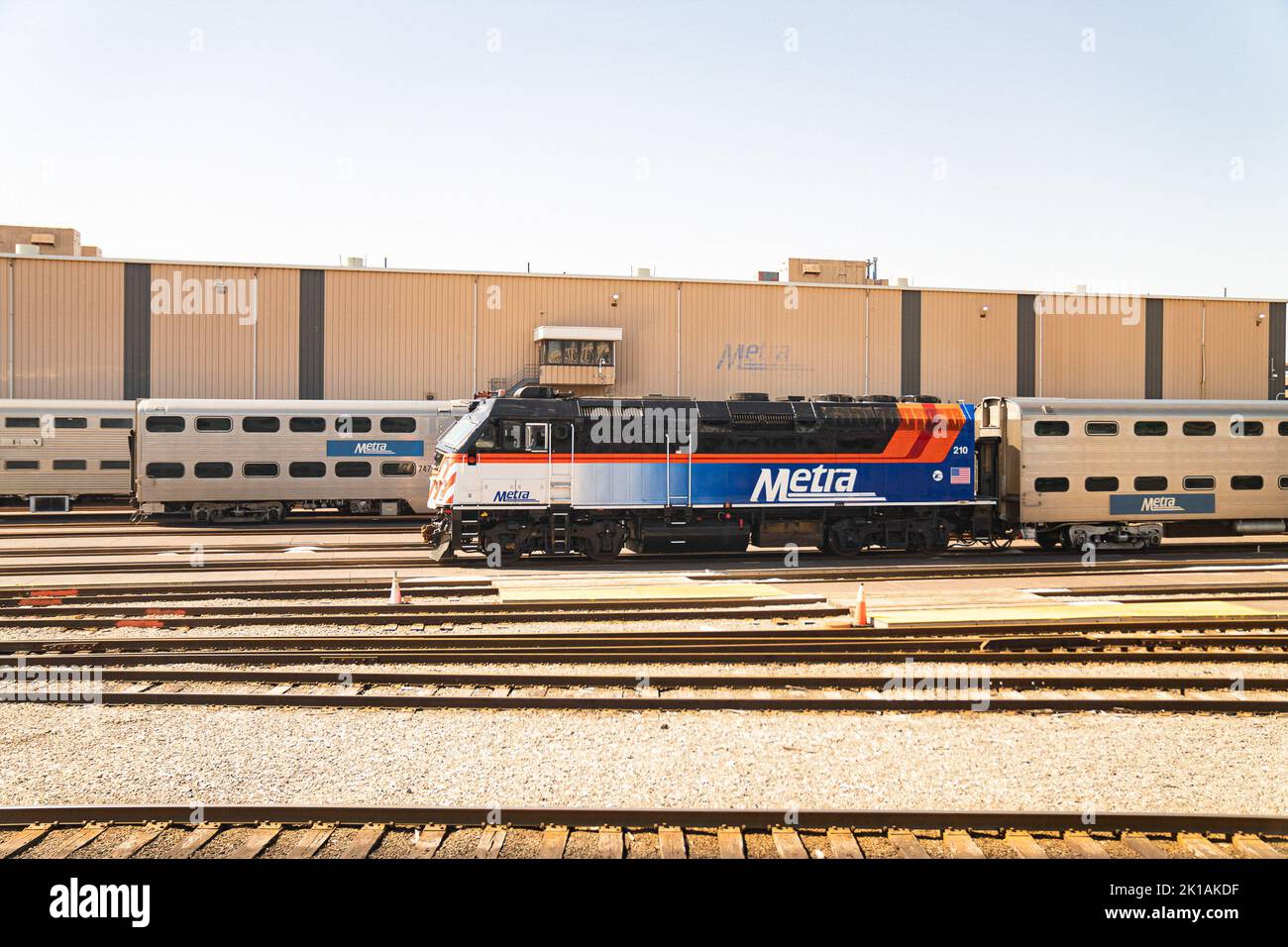 A Metra train stands along the tracks. President Joe Biden announced a ...