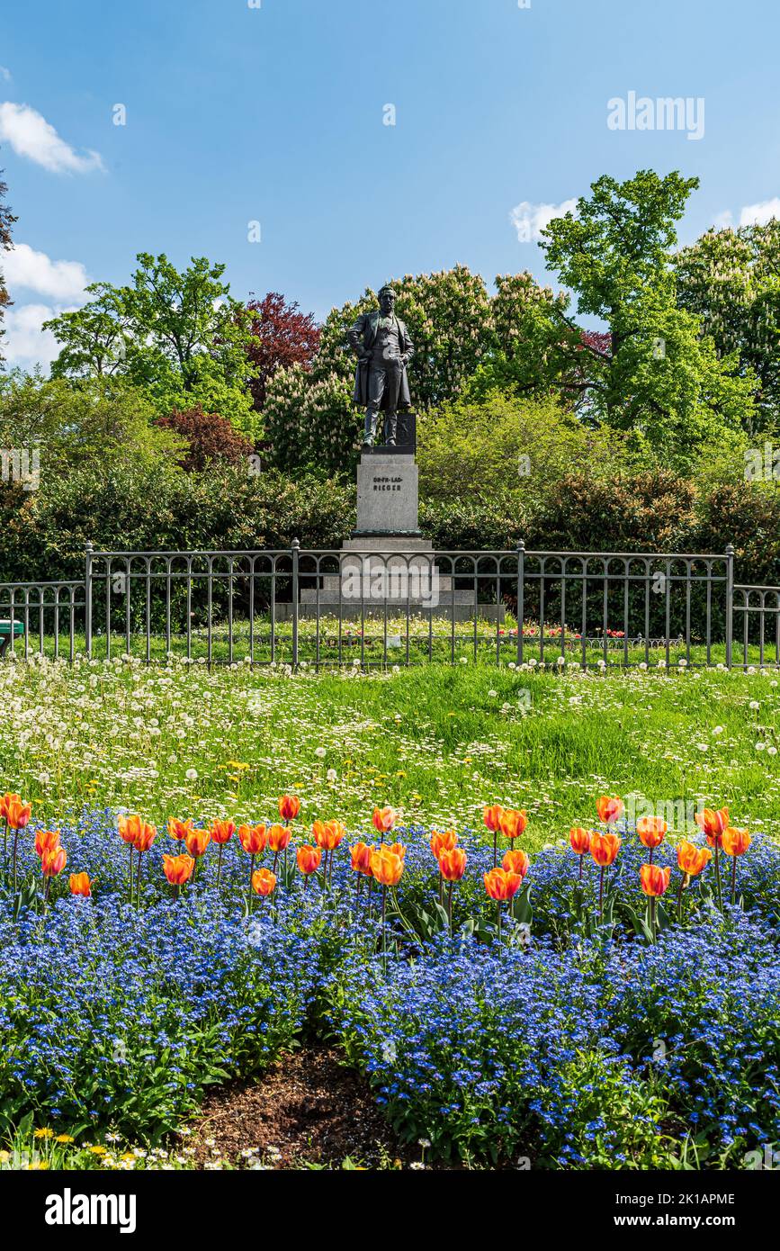 Riegrovy sady public par with flowering tulips and statue of Ladislav Riegerk in Prague city in Czech republic Stock Photo