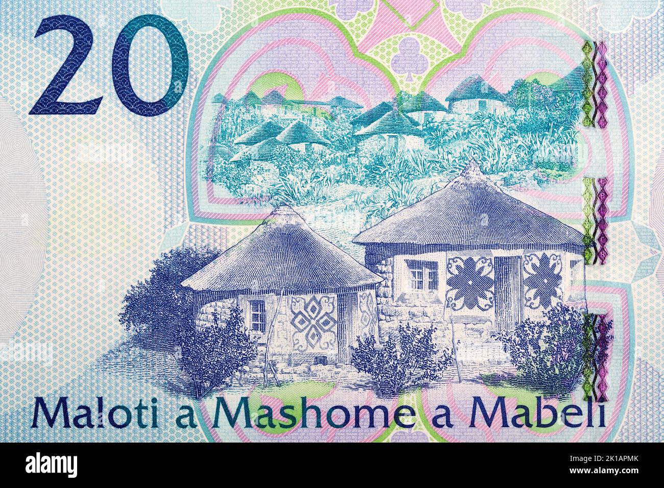 Small houses from banknotes of Lesotho - Maloti Stock Photo