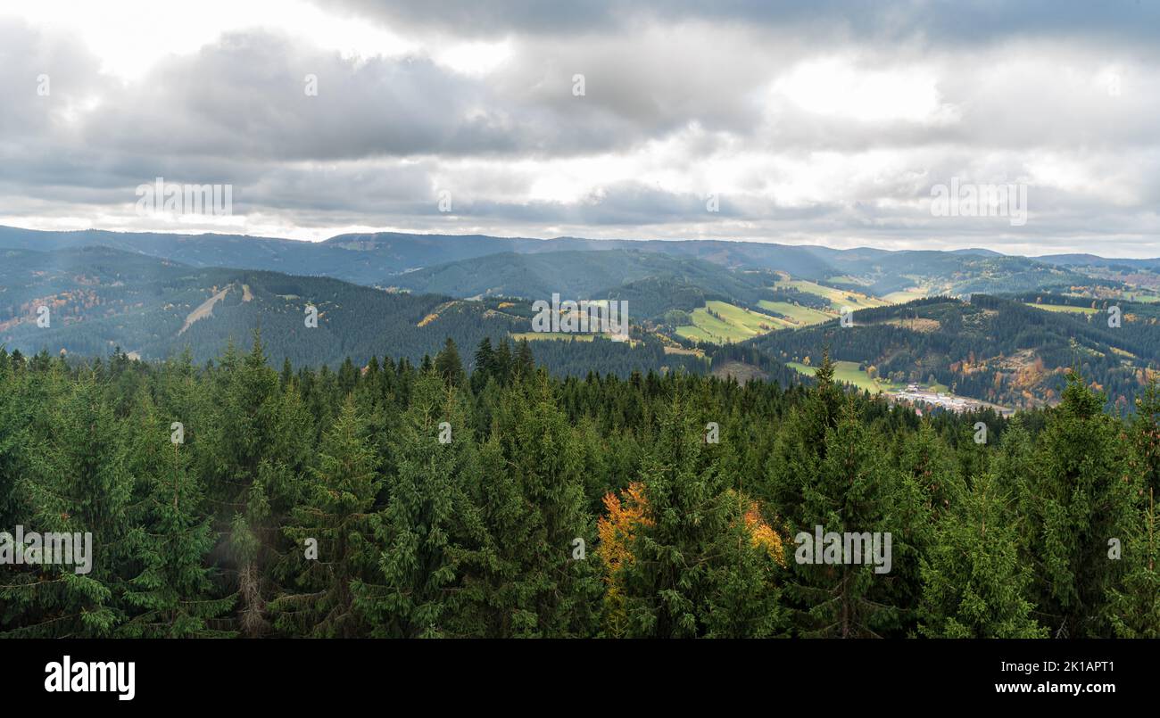 View from lookout tower on Milonova hill above Velke Karlovice village in Czech republic during mostly cloudy autumn day Stock Photo
