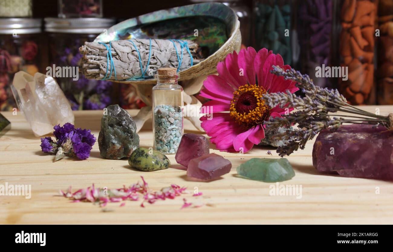 Dried Flowers and Crystal Chakra Stones on Meditation Altar Shallow DOF