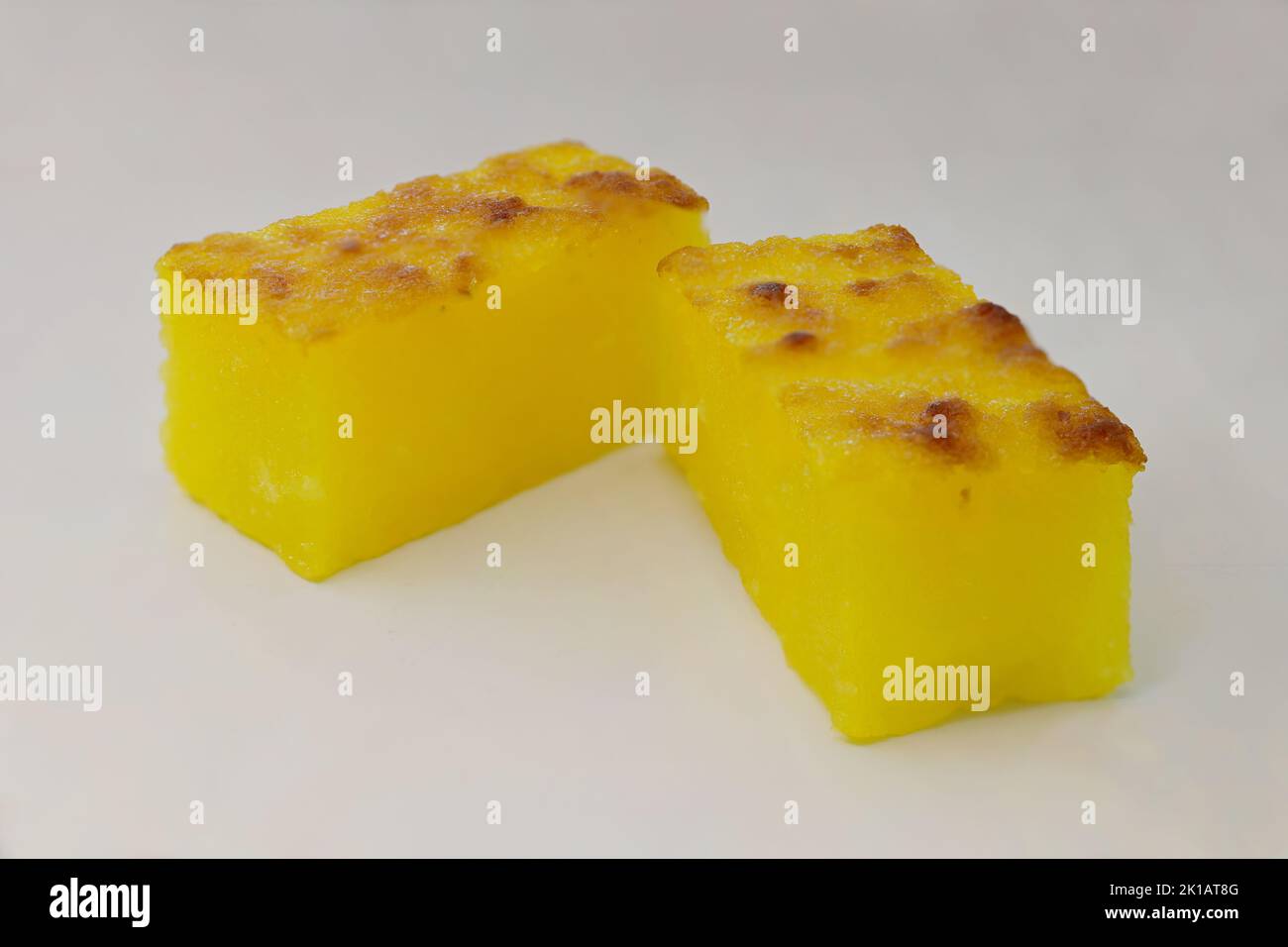 Kueh Bingka Ubi is made from grated tapioca (cassava) and baked until the top and sides are crispy brown Stock Photo