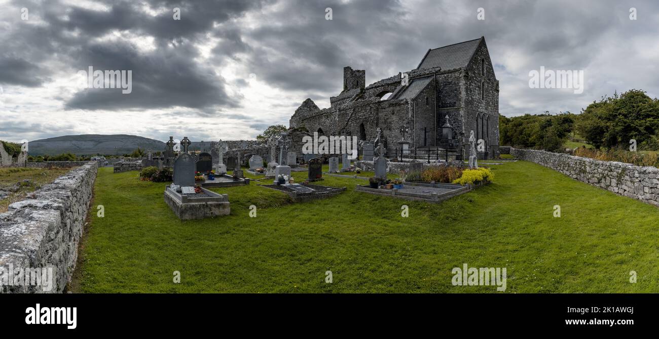 Ballyvaughan, Ireland - 28 July, 2022: panorama view of the historic 13th-century Corcomroe Abbey and cemetery in County Clare Stock Photo