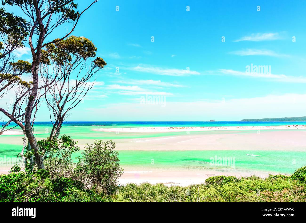 Swirling coastal inlet with tidal sands on a picturesque sunny day Stock Photo