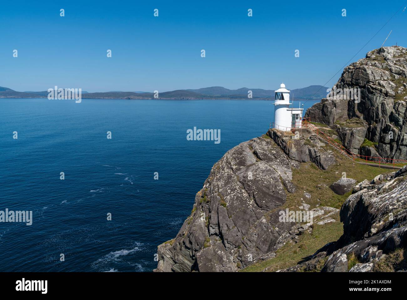 A view of the historic Sheep's Head Lighthouse on the Muntervary Peninsula in County Cork of Ireland Stock Photo