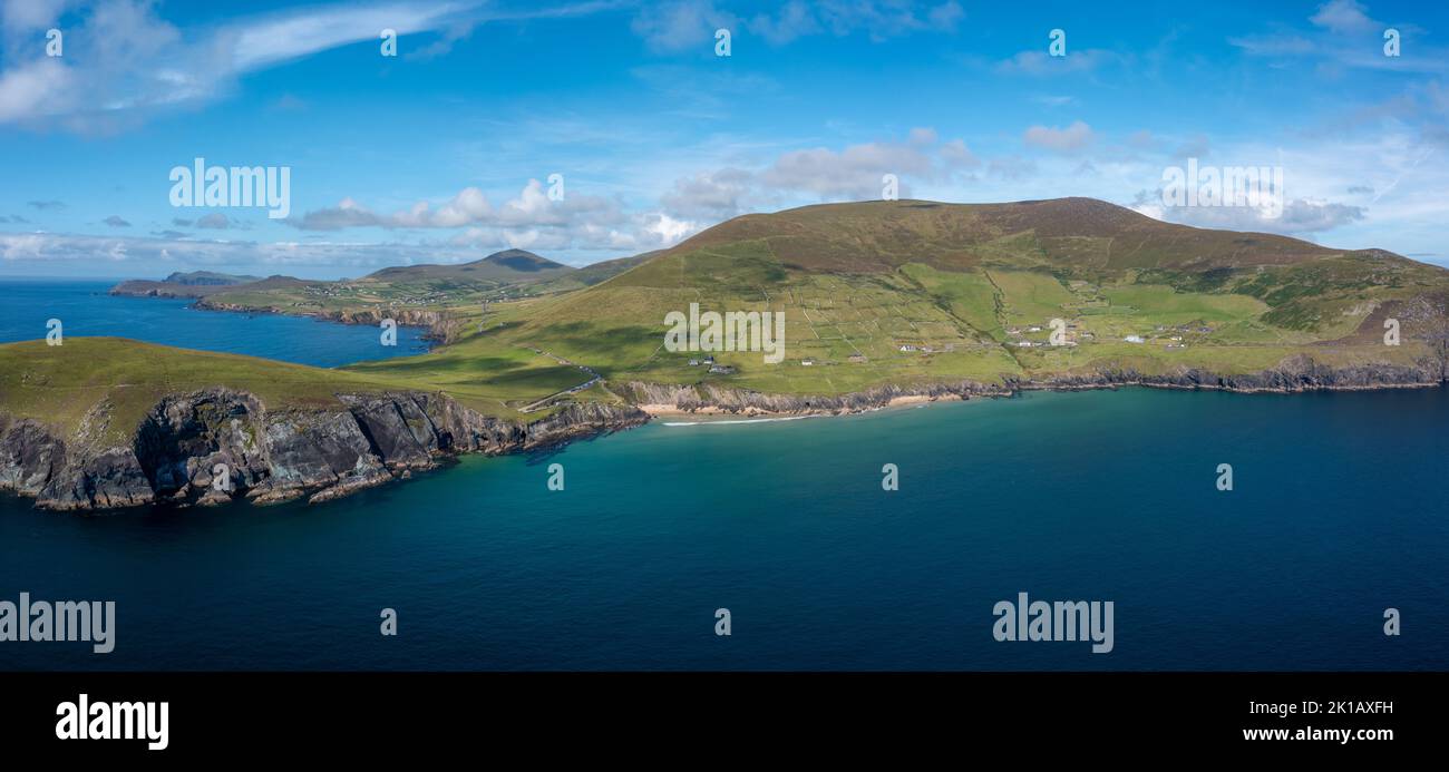 landscape view of the turquoise waters and golden sand beach at Slea Head on the Dingle Peninsula of County Kerry in western Ireland Stock Photo