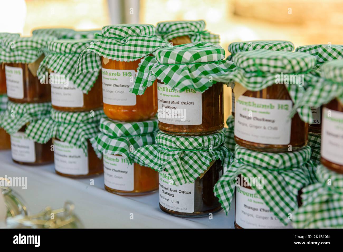 Locally produced jams and chutneys on a market stall. Stock Photo