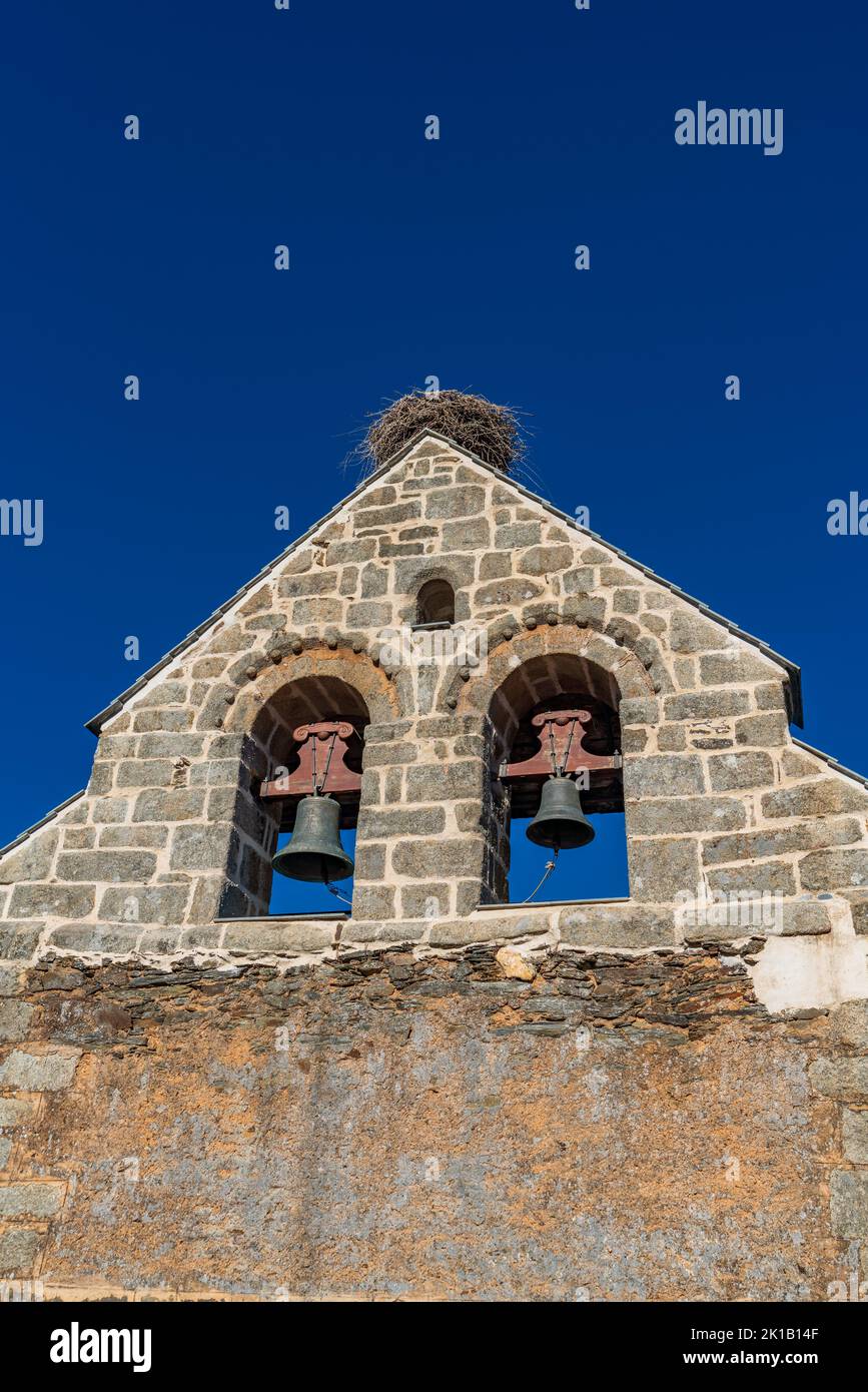 Stork nest on top of the belfry under clear blue sky Stock Photo