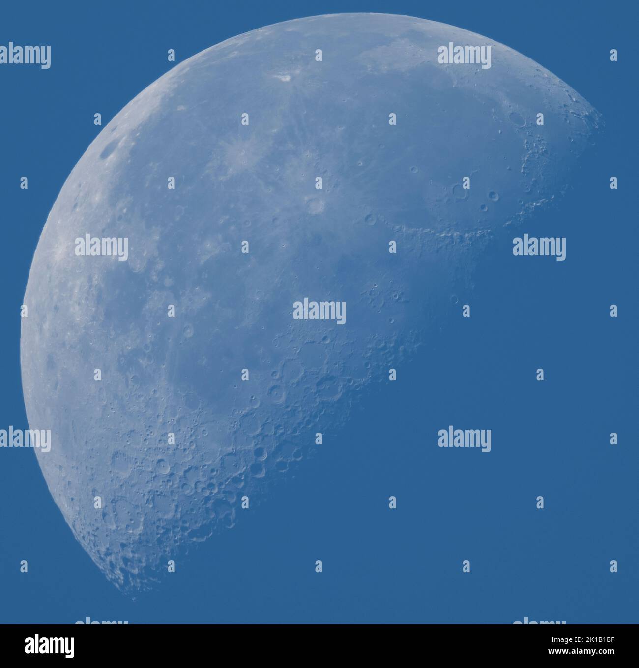 London, UK. 17 September 2022. Morning blue sky and Autumnal temperatures in the capital. Closeup image of the third quarter moon with detailed surface features of craters and mountain ranges. Credit: Malcolm Park/Alamy Live News Stock Photo