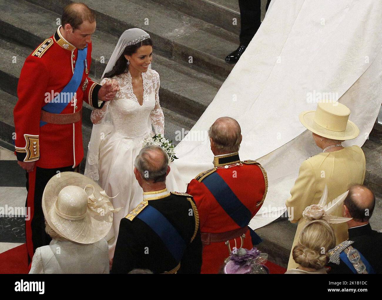 File photo dated 29/04/11 of Prince William and his new bride Kate bow before Queen Elizabeth II following their marriage at Westminster Abbey, London. The late monarch had eight grandchildren, who are performing a vigil around her coffin on Saturday, and 12 great-grandchildren. The Queen was grandmother to eight grandchildren, who all held a deep respect and admiration for their Granny. Peter Phillips, Zara Tindall, the Prince of Wales, the Duke of Sussex, Princess Beatrice, Princess Eugenie, Lady Louise Windsor and Viscount Severn will all honour the late monarch with a vigil around her coff Stock Photo