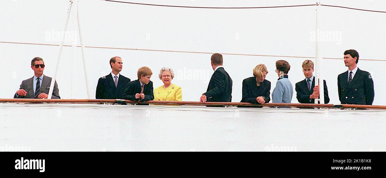 File photo dated 07/08/97 of the Queen with some other members of the Royal family on the stern of Britannia, at Portsmouth this afternoon, for what could be their last summer holiday aboard the Royal Yacht - the annual trip to Balmoral via the Western Isles. (From left: Prince of Wales, Prince Edward, Prince Harry, Queen, Peter Phillips, Zara Phillips, Princess Royal, Prince William, Captain Tim Laurence. The late monarch had eight grandchildren, who are performing a vigil around her coffin on Saturday, and 12 great-grandchildren. The Queen was grandmother to eight grandchildren, who all held Stock Photo
