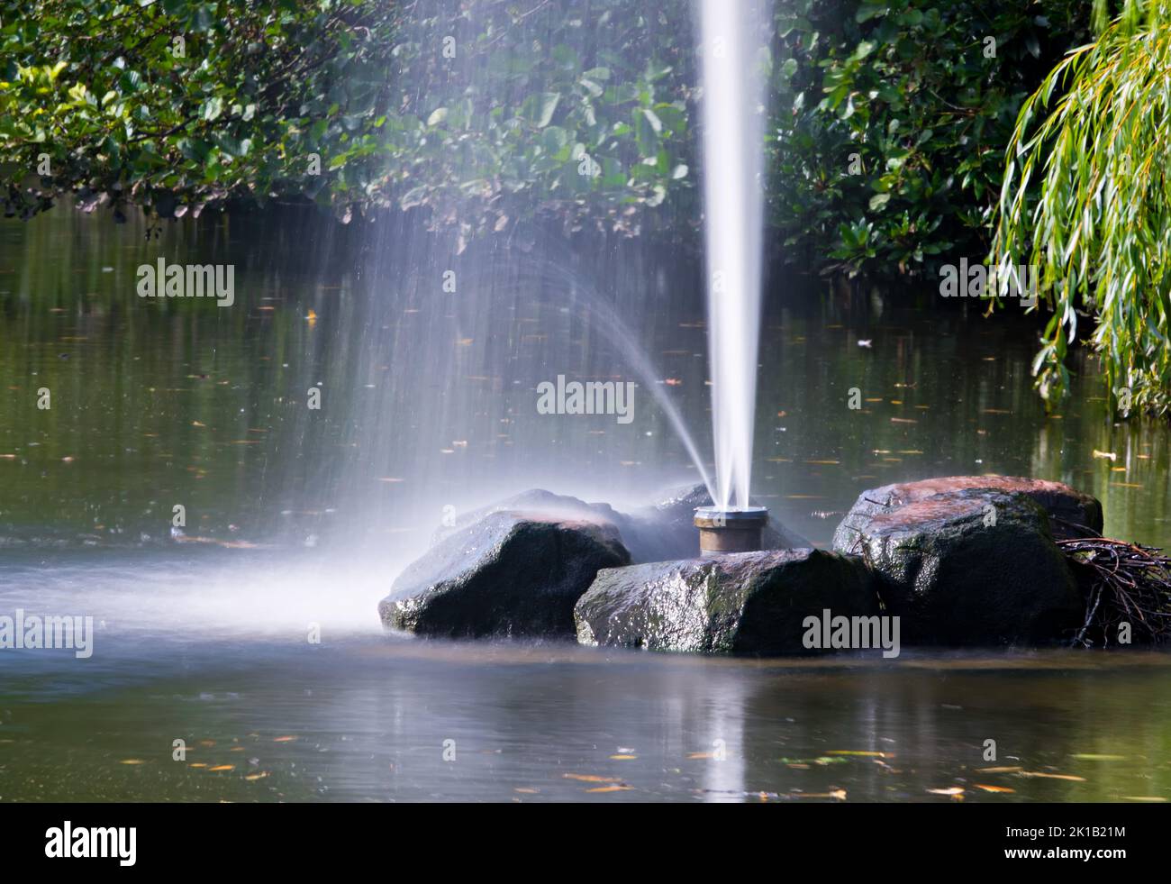 Water fountain in Sefton Park Liverpool taken with a slow shutter speed and an ND64 filter Stock Photo
