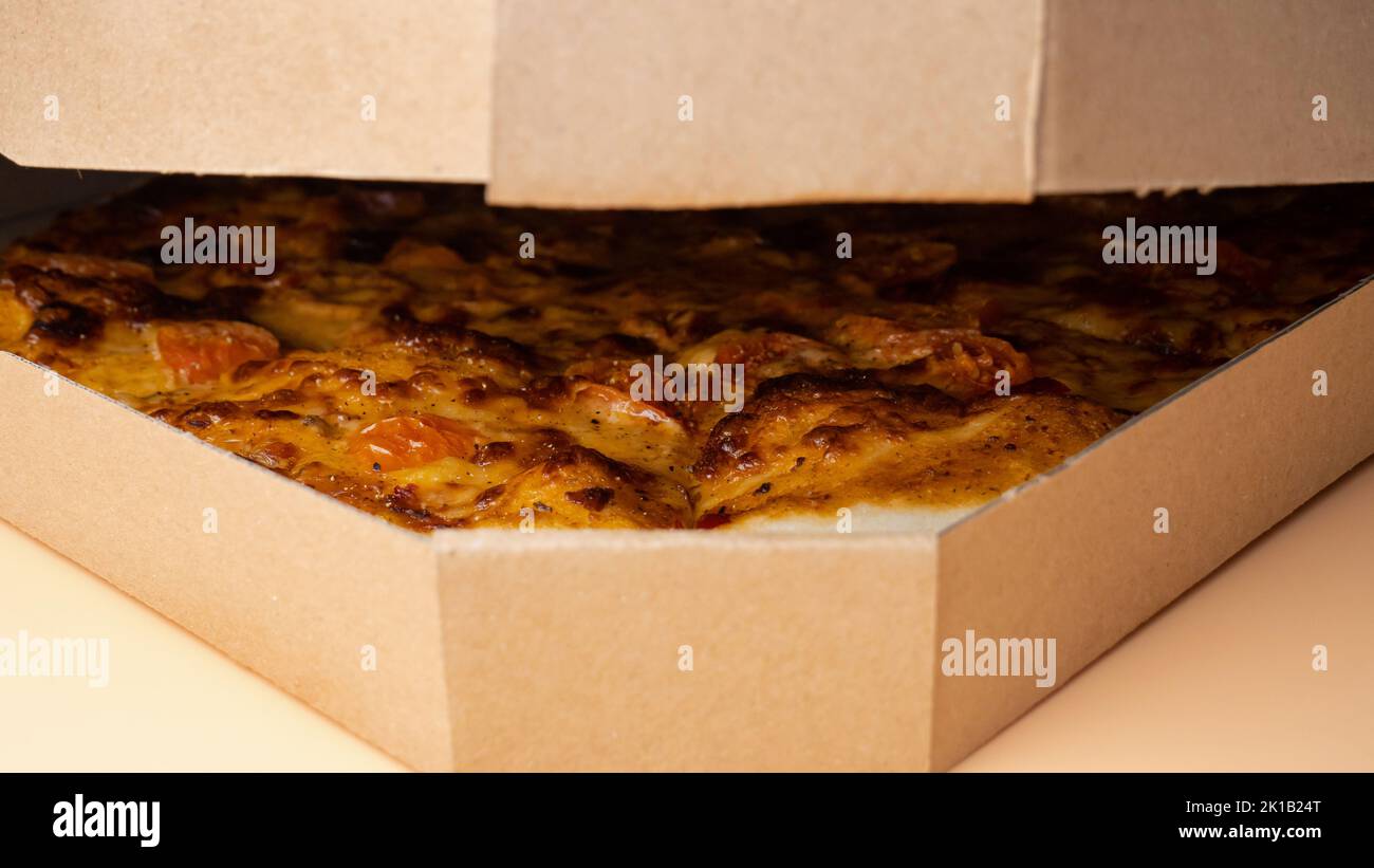 hands open box with mozzarella cheese pizza, delivery pizza Stock Photo