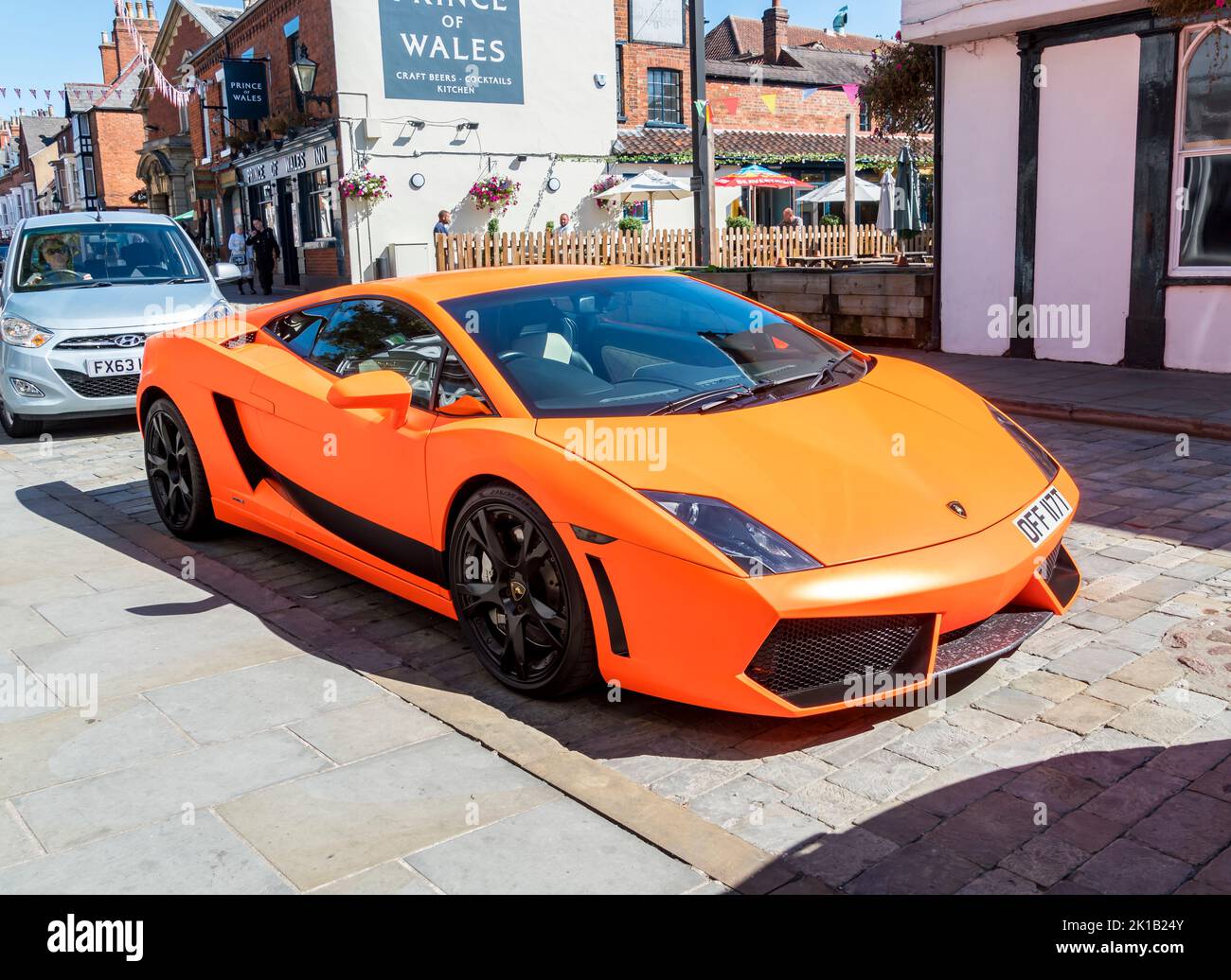 Orange Lamborghini sports car parked in Bailgate, Lincoln city 2022 Stock Photo