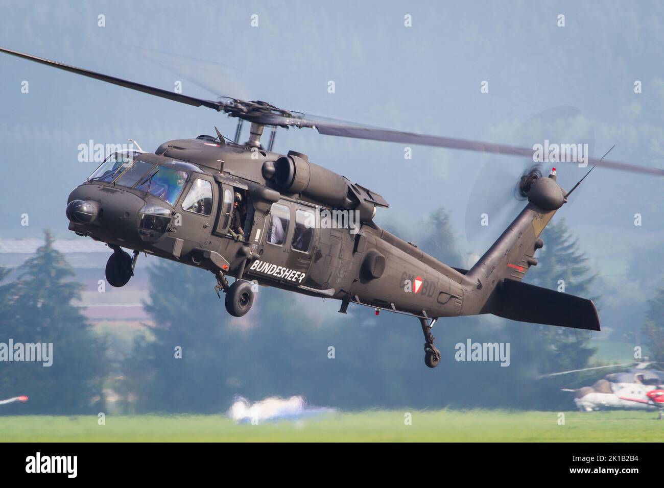 An austrian Bundesheer helikopter Sikorsky Black Hawk landing at airbase Zeltweg in Austria Stock Photo