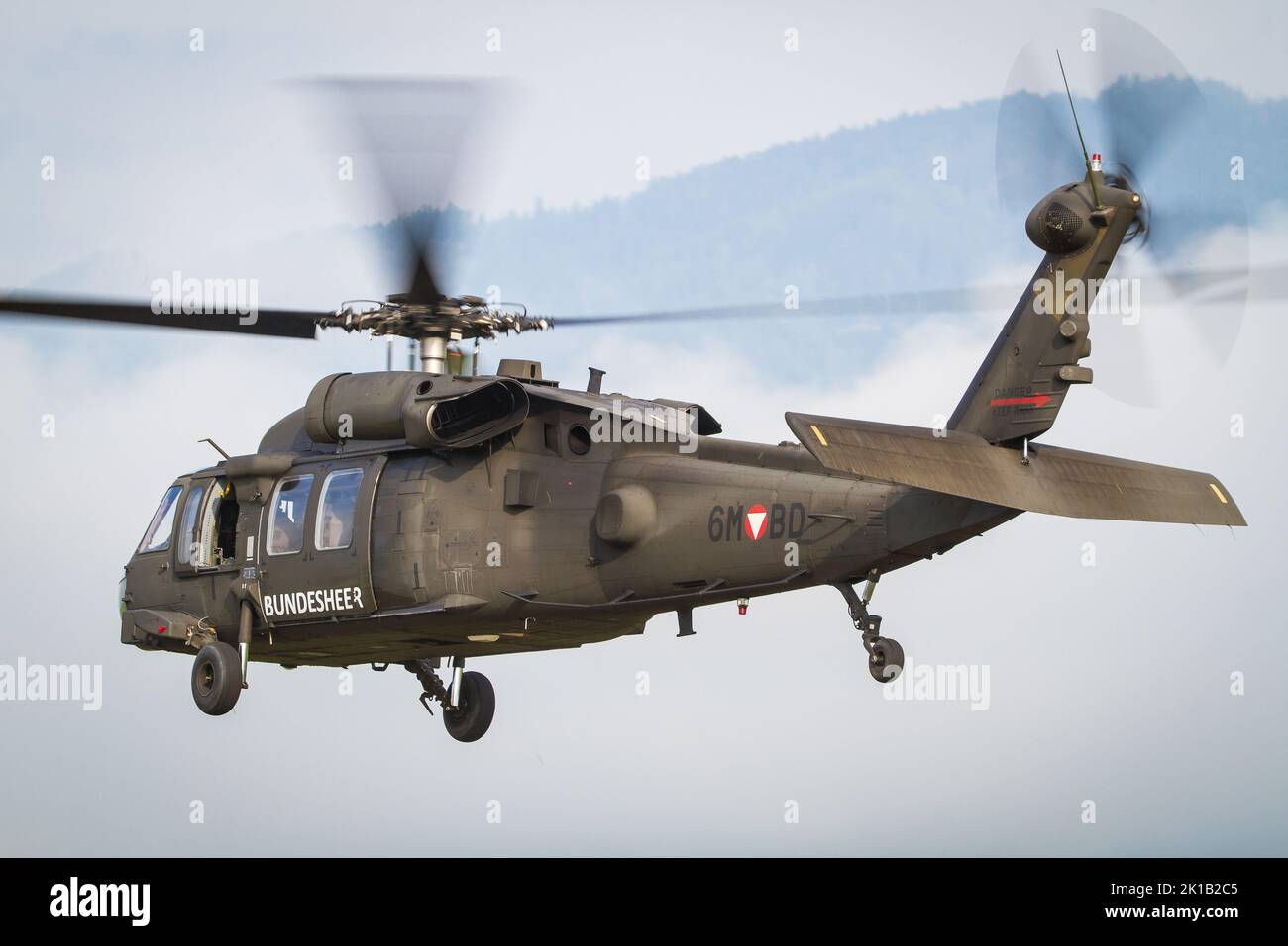 An austrian Bundesheer helikopter Sikorsky Black Hawk departing airbase Zeltweg in Austria Stock Photo