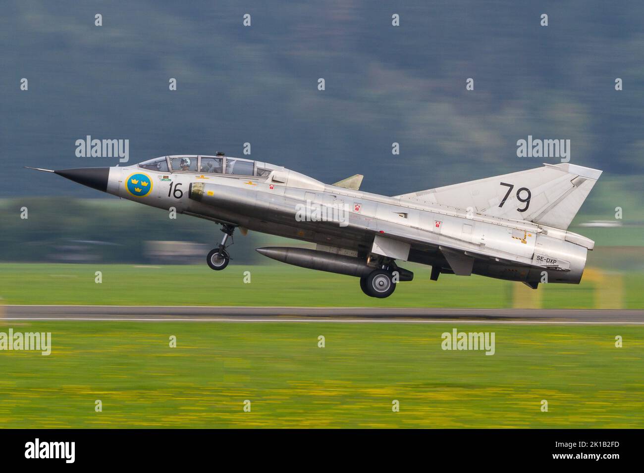 A Saab Draken military jet of the Swedish Air Force landing in Zeltweg, Austria to attend the Airpower airshow Stock Photo