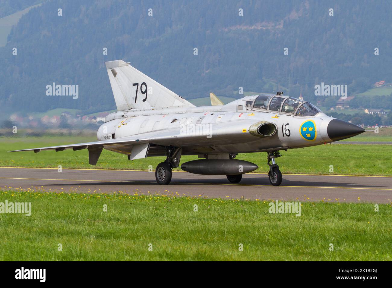 A Saab Draken military jet of the Swedish Air Force landing in Zeltweg, Austria to attend the Airpower airshow Stock Photo