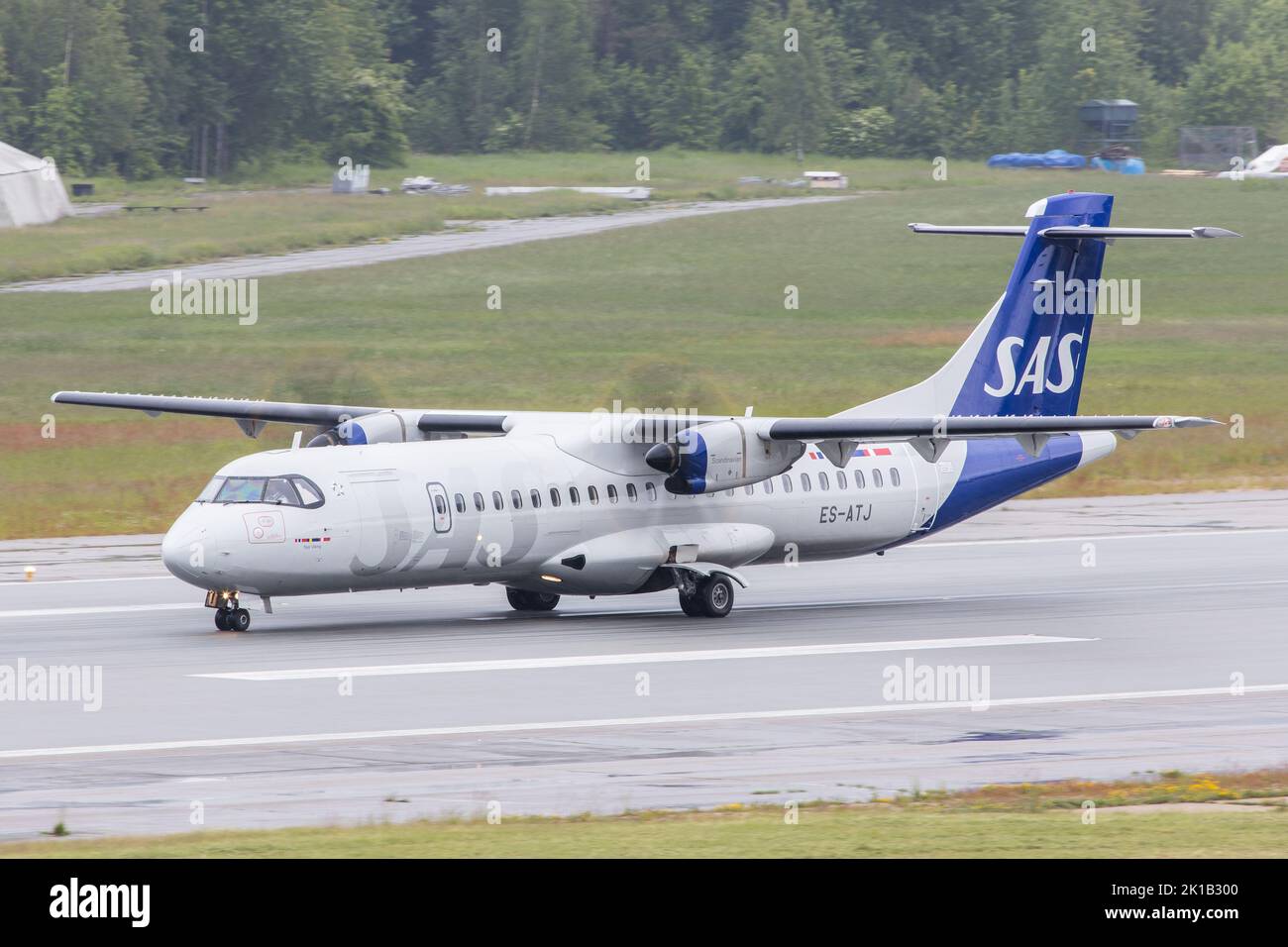 An ATR-72 turboprop airliner of SAS Scandinavian Airlines taxiing on the runway for departure to Oslo Stock Photo