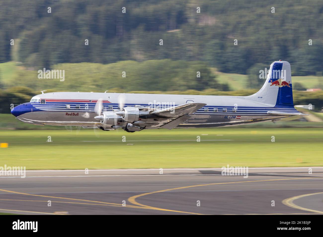 The beautiful restored Douglas DC-6 of the Flying Bulls fleet taking off in Zeltweg in Austria Stock Photo