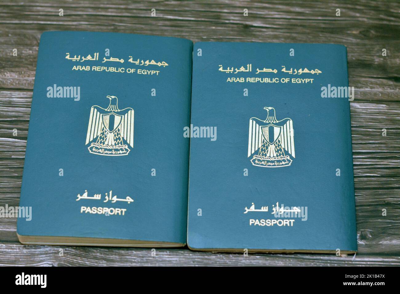 Egyptian passport isolated on wooden background, Arab republic of Egypt