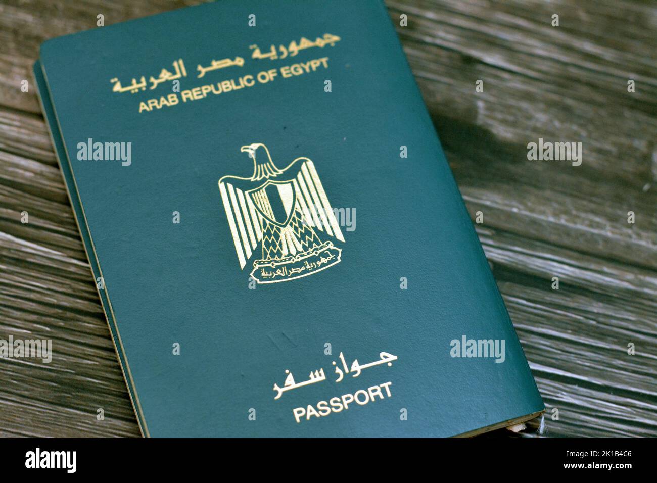 Egyptian passport isolated on wooden background, Arab republic of Egypt