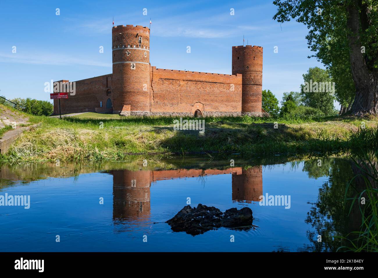 Castle of the Masovian Dukes by the Lydynia River, medieval fortress with reflection in water in Ciechanow, Masovia, Poland. Stock Photo