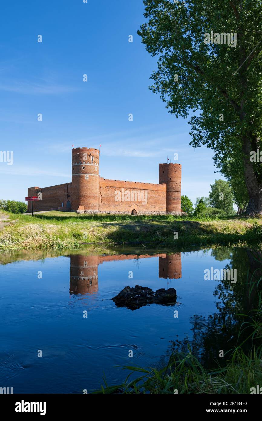 Castle of the Masovian Dukes by the Lydynia River, medieval fortress with reflection in water in Ciechanow, Masovia, Poland. Stock Photo