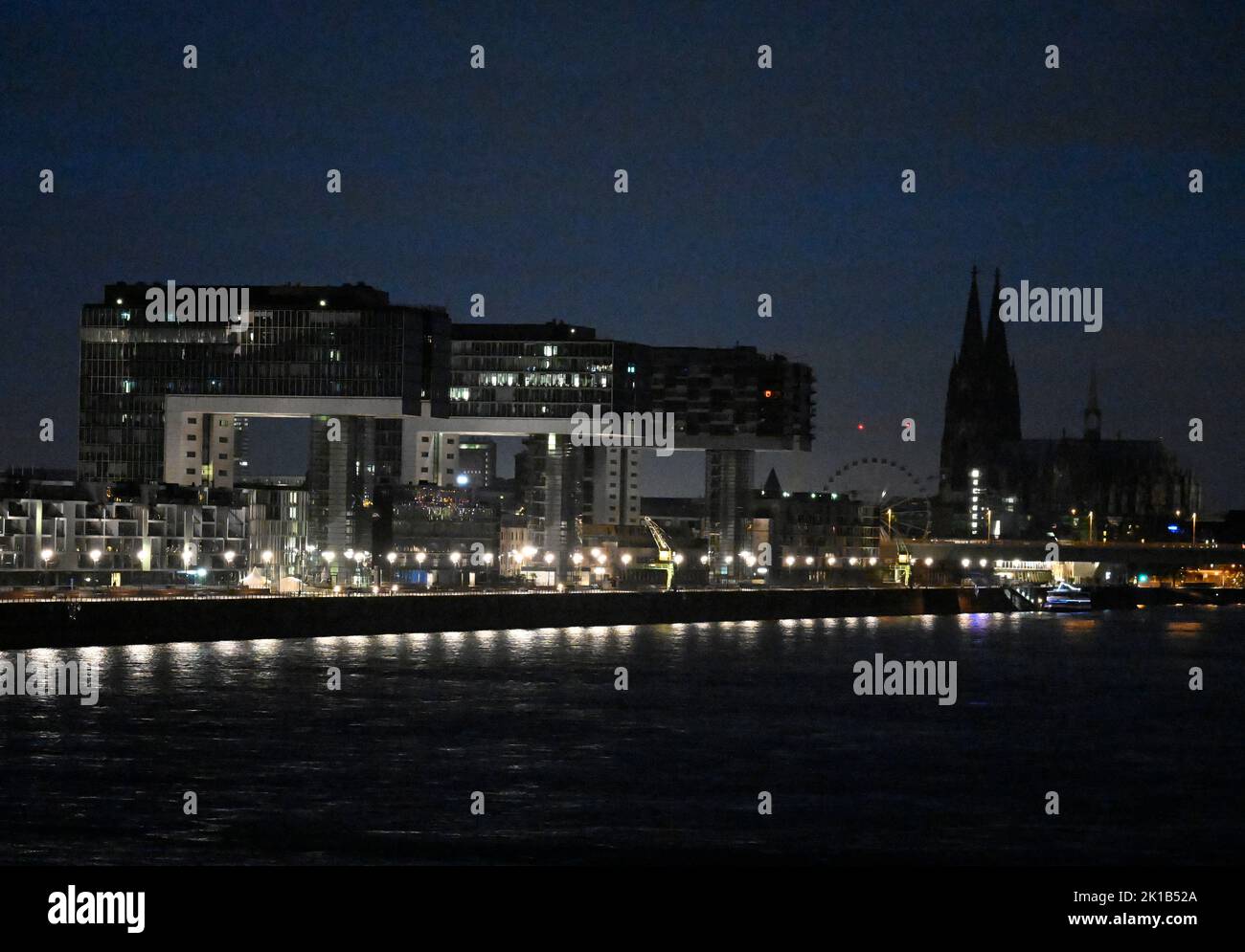 Cologne, Germany. 17th Sep, 2022. The three crane buildings and Cologne Cathedral are not illuminated at night. By not illuminating the landmark cathedral, the city of Cologne wants to make a contribution to counteracting the impending energy shortage. Credit: Roberto Pfeil/dpa/Alamy Live News Stock Photo