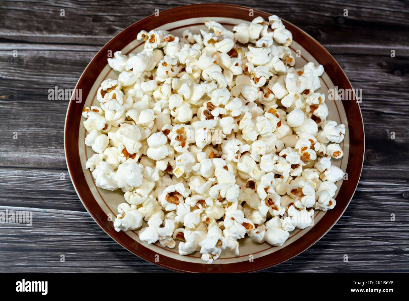 A plate of Popcorn and also called popped corn, popcorns or popcorn